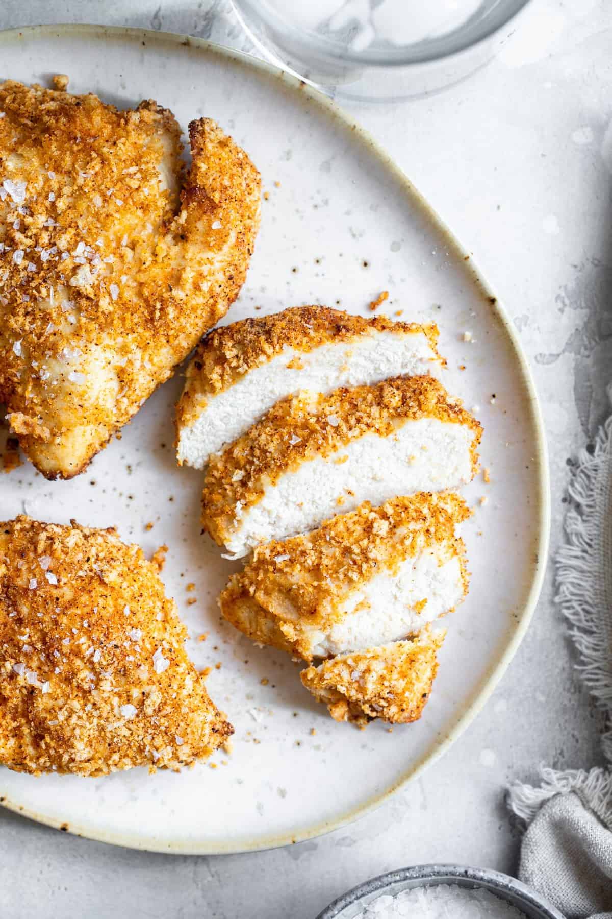 overhead image of sliced Air Fryer Breaded Chicken Breast on a plate