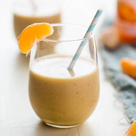 Banana Creamsicle Protein Smoothie - This orange smoothie is SO thick, creamy, and packed with vanilla protein powder so it tastes like a creamsicle! Ready in 5 minutes, loading with antioxidants and perfect for post workout recovery! | Foodfaithfitness.com | @FoodFaithFit