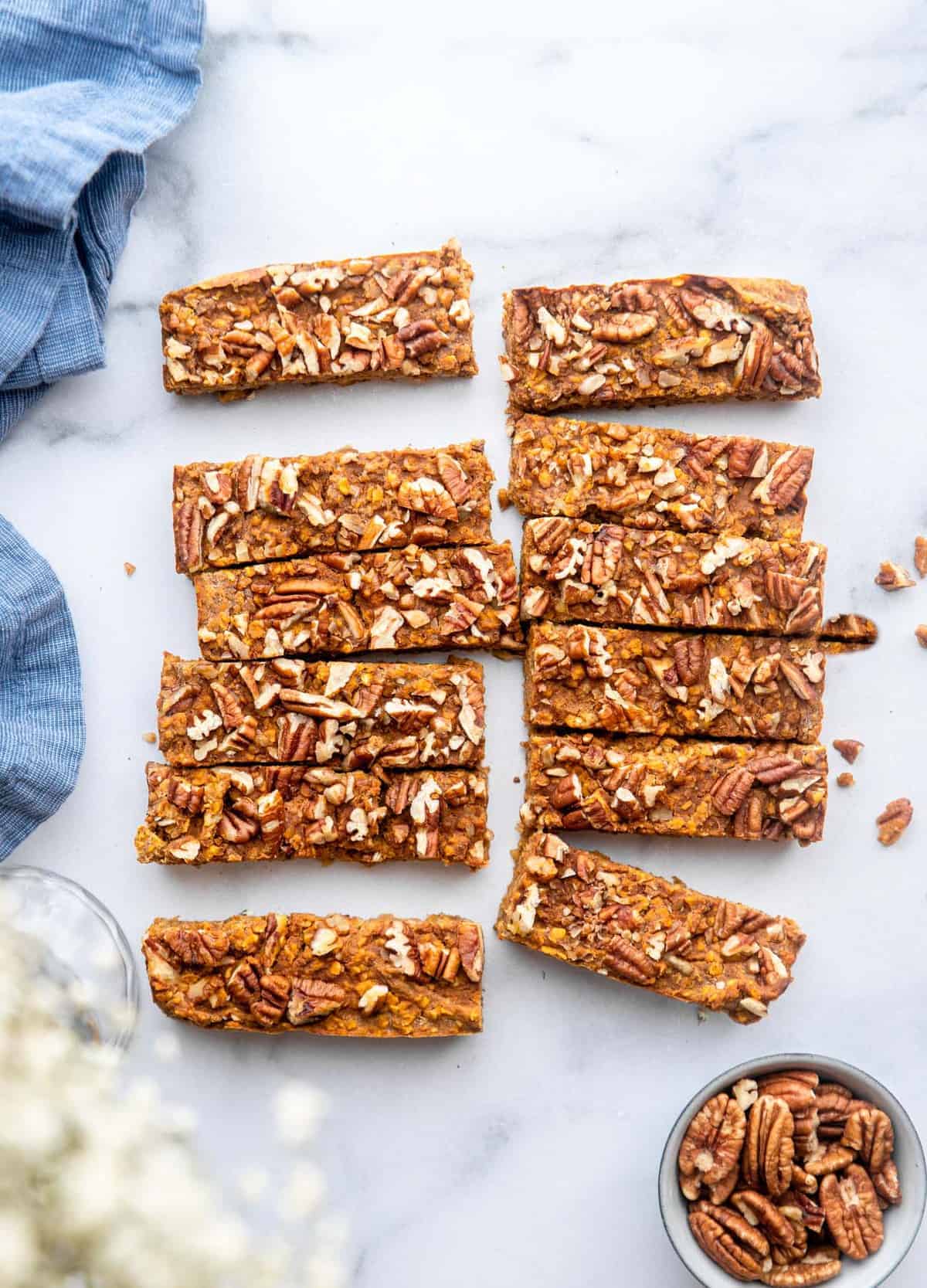 homemade pumpkin protein bars slices with pecans on top